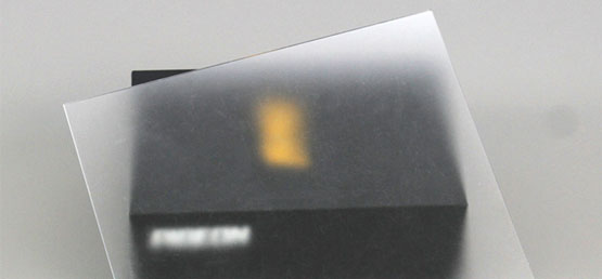 Side-by-side comparison of frosted and clear acrylic sheets